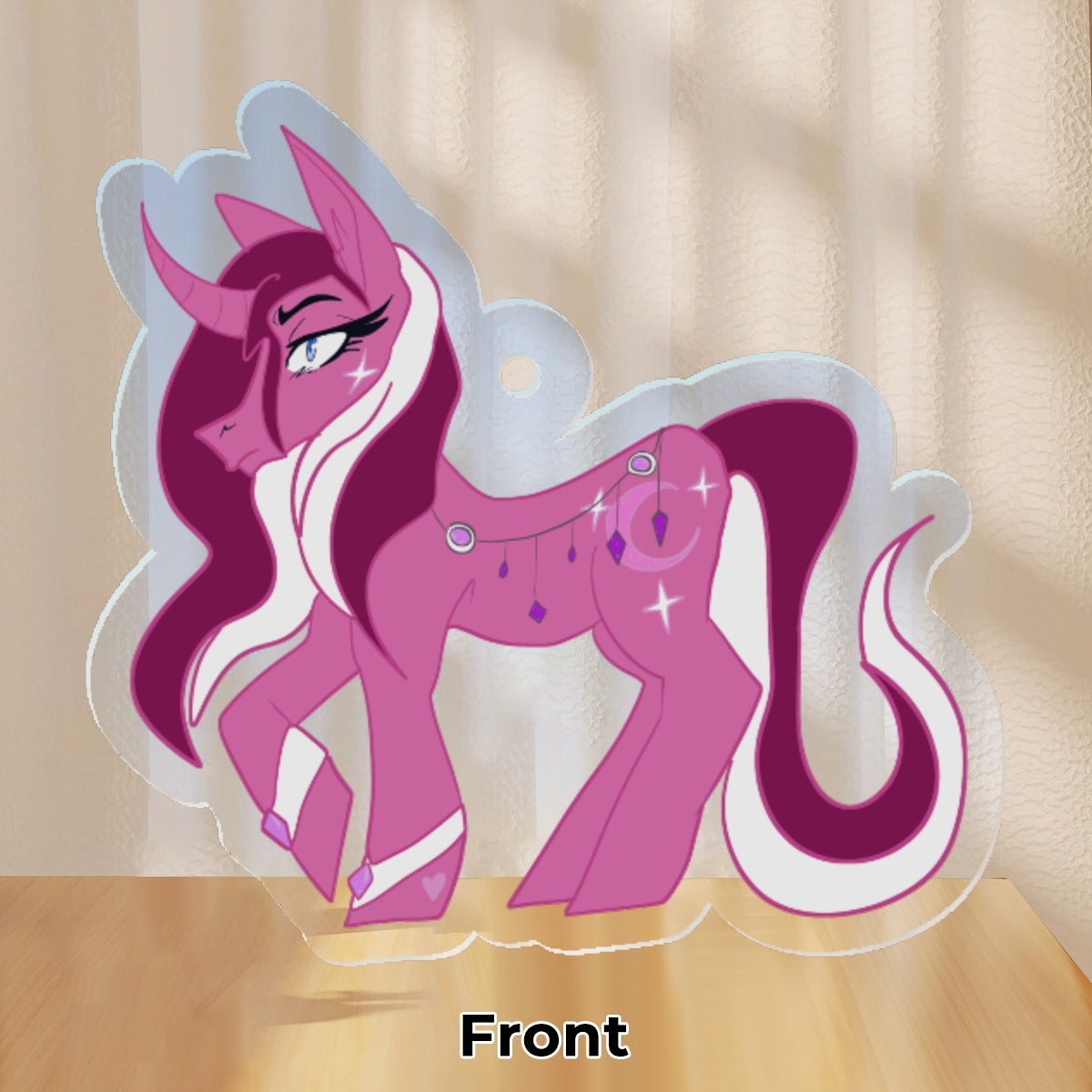 A Matte Rose unicorn with a wavy two toned, Siren Reddish Pink & White, mane and tail, her tail curls outwards at the end. She has Shocking White metal cuffs on her front hooves with Calypso Orchid Pink gems on the front. The same gems are strewn across her back, encased in the same Shocking White metal and chain with Electric Violet crystals hanging down. She has a white 4 pointed star on her cheek. The same 4 pointed stars shimmer around her Pink crescent moon cutie mark.